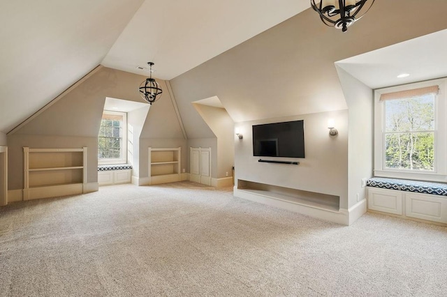 6225 Random Winds Blf, Gainesville, GA 30506 - bonus room with built in shelves, carpet, lofted ceiling, and a chandelier