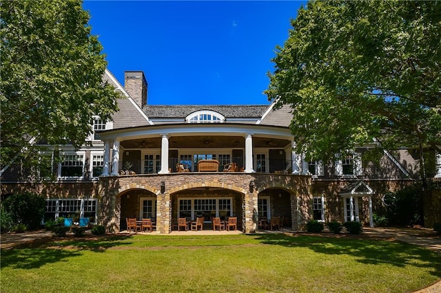 6225 Random Winds Blf, Gainesville, GA 30506 - back of property with a balcony, a yard, a chimney, stone siding, and a patio area