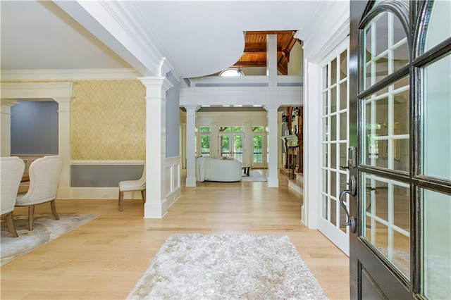 6225 Random Winds Blf, Gainesville, GA 30506 - entryway with french doors, decorative columns, wallpapered walls, wood finished floors, and ornamental molding