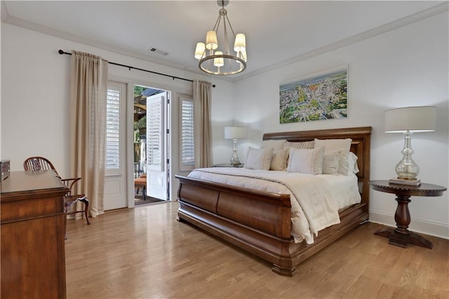 2620 Middle Coray Cir, Marietta, GA 30066 - bedroom with visible vents, light wood-style flooring, access to exterior, crown molding, and a chandelier
