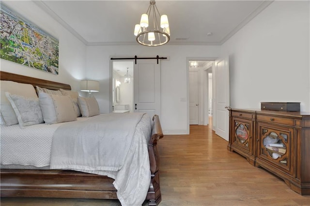 2620 Middle Coray Cir, Marietta, GA 30066 - bedroom with a barn door, baseboards, ornamental molding, and light wood finished floors