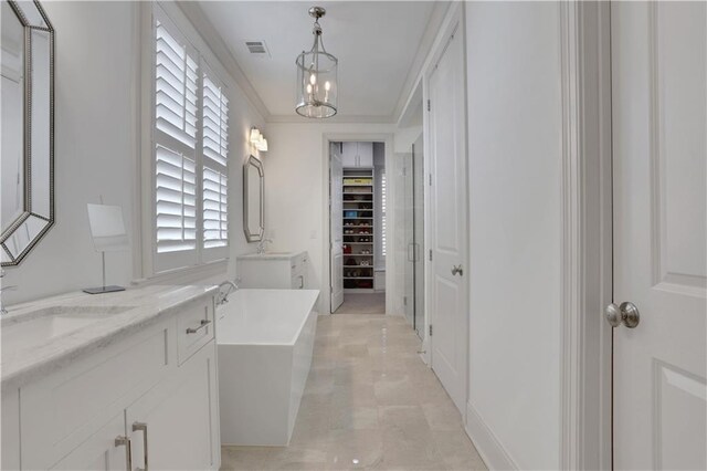 2620 Middle Coray Cir, Marietta, GA 30066 - full bathroom featuring visible vents, a sink, crown molding, double vanity, and a freestanding bath