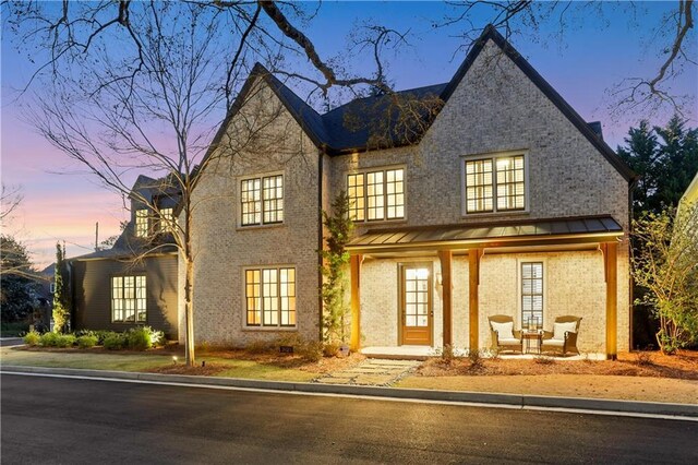 2620 Middle Coray Cir, Marietta, GA 30066 - view of front of property featuring a standing seam roof, brick siding, and metal roof