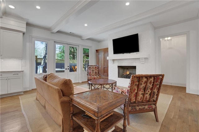 2620 Middle Coray Cir, Marietta, GA 30066 - living room with beamed ceiling, recessed lighting, french doors, light wood-style floors, and a brick fireplace
