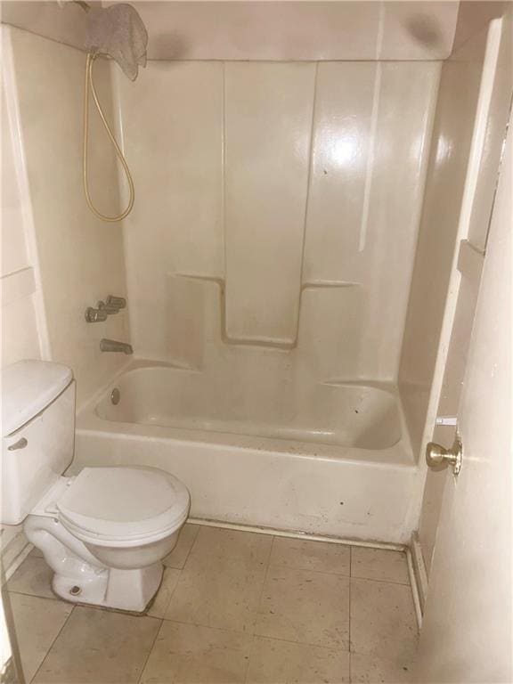 bathroom featuring tile patterned flooring,  shower combination, and toilet