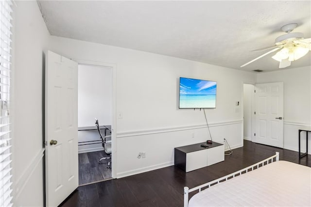 bedroom featuring dark wood-type flooring and ceiling fan