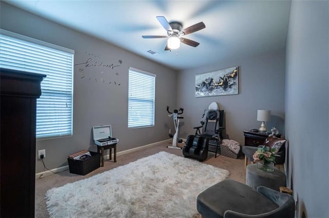 workout area with a ceiling fan, baseboards, visible vents, and carpet floors