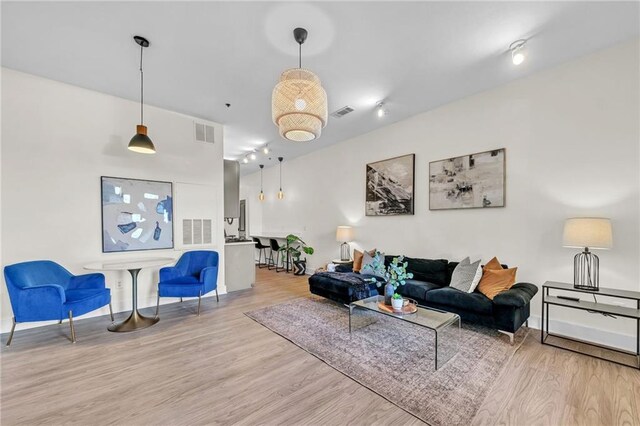 living room with light hardwood / wood-style flooring