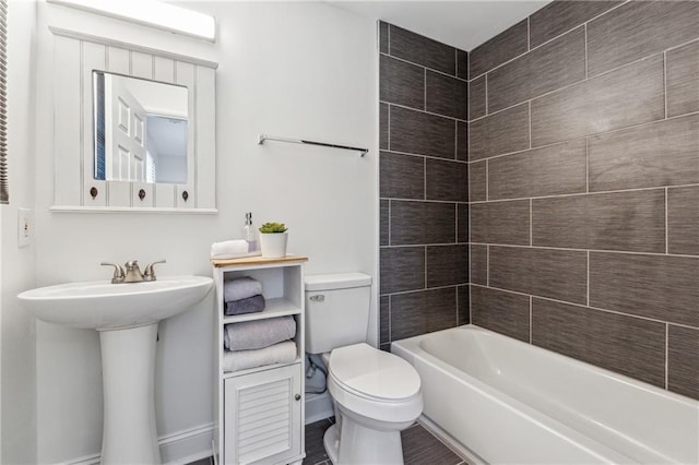 full bathroom featuring shower / bathtub combination, sink, and toilet