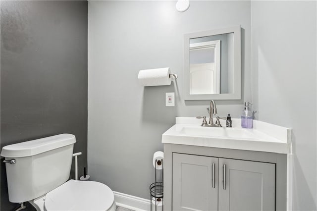 bathroom featuring toilet and vanity