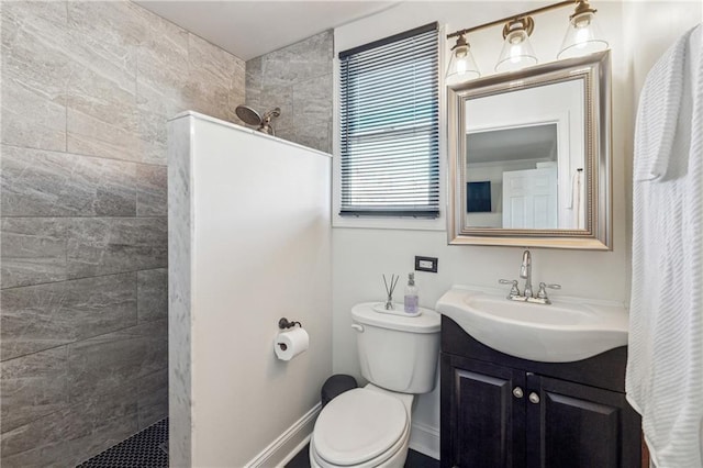 bathroom featuring curtained shower, toilet, and vanity