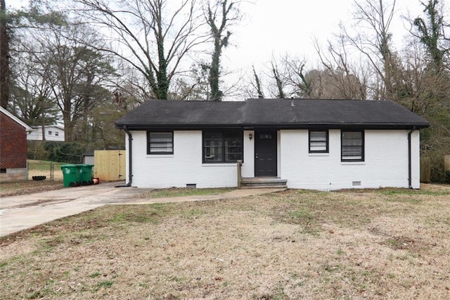 ranch-style house with crawl space, a front yard, fence, and brick siding