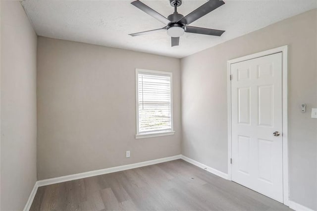 2945 Catalina Dr, Decatur, GA 30032 - unfurnished room with ceiling fan, a textured ceiling, baseboards, and wood finished floors