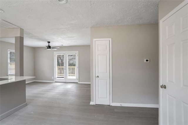 2945 Catalina Dr, Decatur, GA 30032 - unfurnished room featuring a textured ceiling, wood finished floors, a ceiling fan, and baseboards