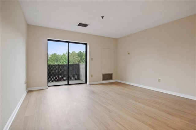 empty room with light wood-type flooring