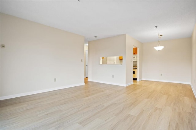 unfurnished living room with light hardwood / wood-style flooring