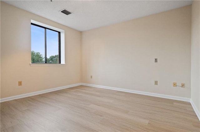 unfurnished room featuring light hardwood / wood-style flooring