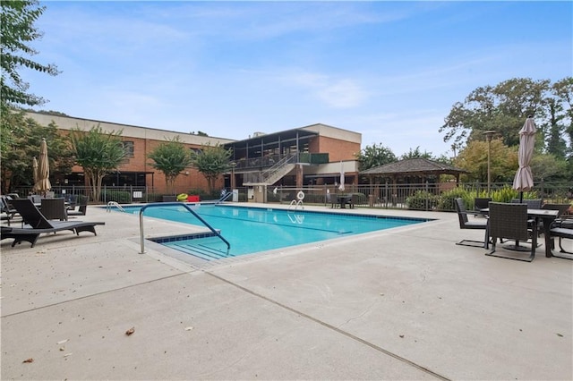 view of swimming pool featuring a patio area