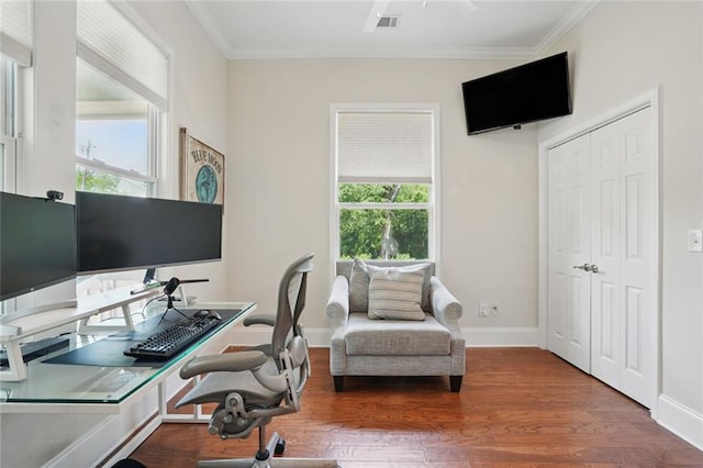 office with ornamental molding, healthy amount of natural light, wood finished floors, and baseboards