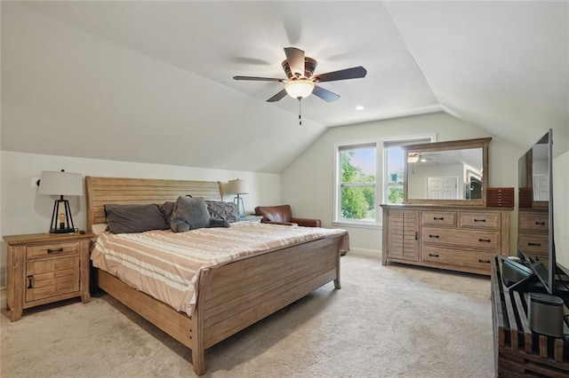 bedroom featuring light carpet, lofted ceiling, a ceiling fan, and baseboards