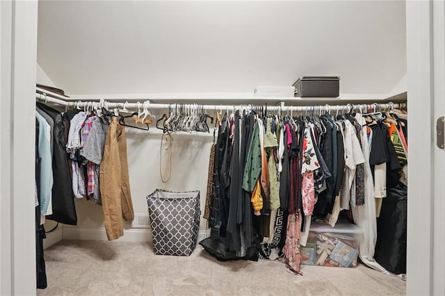 spacious closet featuring carpet and lofted ceiling