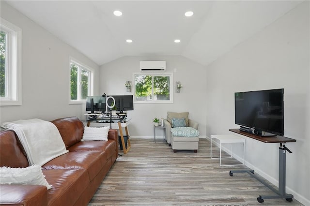 living area with a wall mounted AC, wood finished floors, lofted ceiling, recessed lighting, and baseboards