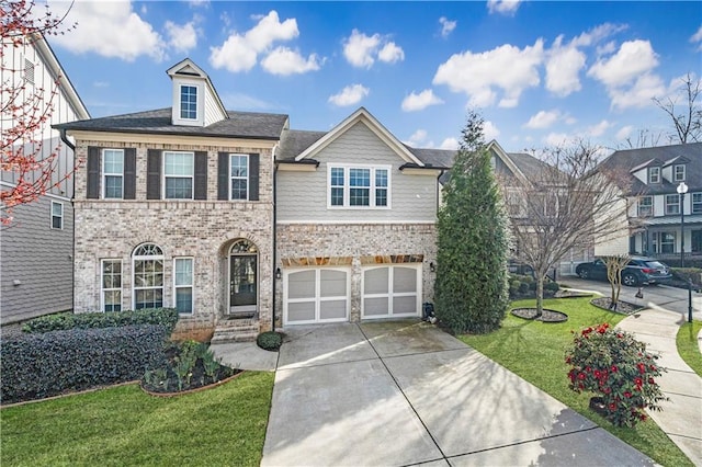 view of front facade with a garage, a front yard, brick siding, and driveway