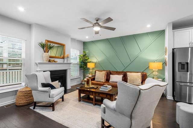 1098 Caruso Dr, Buford, GA 30518 - living room with ceiling fan, a wealth of natural light, baseboards, and wood finished floors