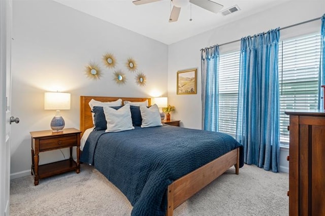 1098 Caruso Dr, Buford, GA 30518 - bedroom featuring light colored carpet, visible vents, and a ceiling fan