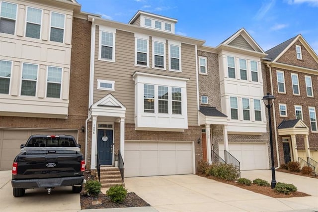1098 Caruso Dr, Buford, GA 30518 - multi unit property with an attached garage, brick siding, and driveway