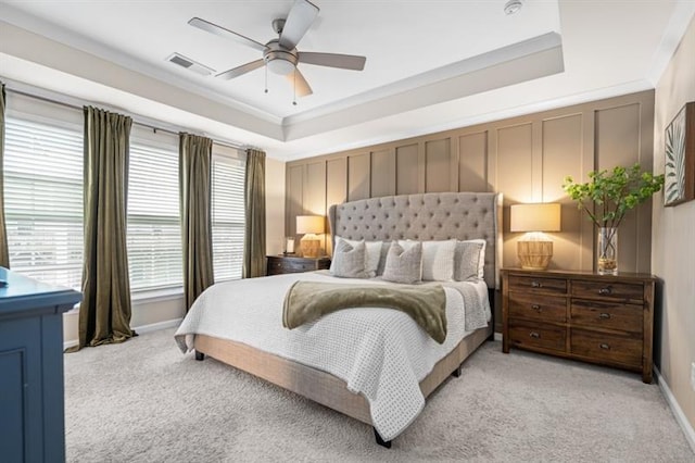 1098 Caruso Dr, Buford, GA 30518 - bedroom featuring a raised ceiling, light carpet, crown molding, and visible vents