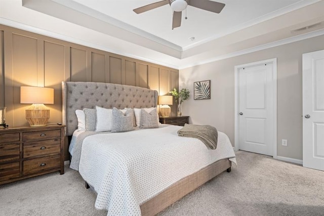 1098 Caruso Dr, Buford, GA 30518 - bedroom featuring light colored carpet, visible vents, crown molding, a ceiling fan, and a raised ceiling