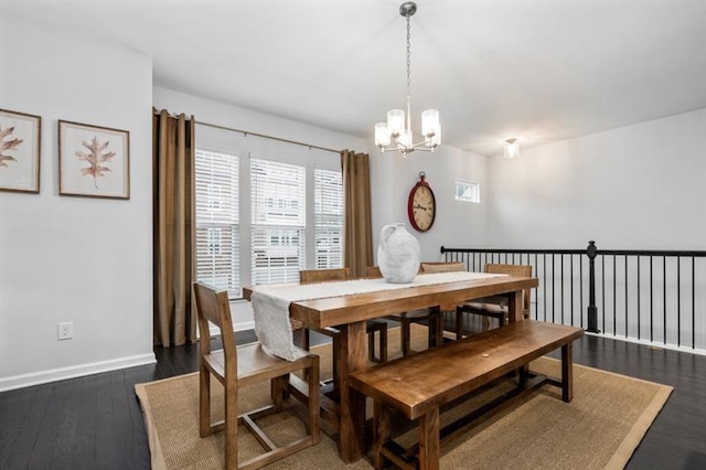 1098 Caruso Dr, Buford, GA 30518 - dining space with a notable chandelier, baseboards, and dark wood finished floors