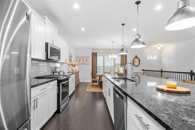 1098 Caruso Dr, Buford, GA 30518 - kitchen with recessed lighting, a sink, backsplash, white cabinets, and appliances with stainless steel finishes