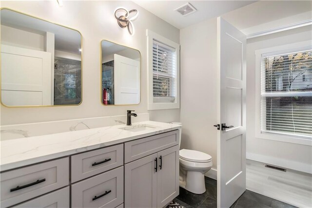 full bathroom with toilet, vanity, and shower / bathtub combination with curtain