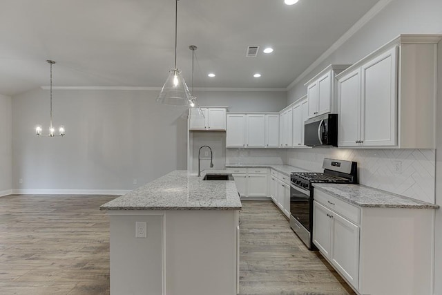 223 Montview Dr, Jefferson, GA 30549 - kitchen featuring a sink, stainless steel appliances, ornamental molding, visible vents, and decorative backsplash