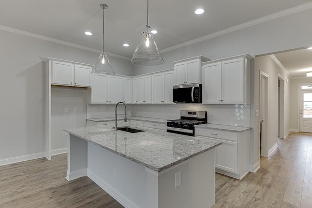 223 Montview Dr, Jefferson, GA 30549 - kitchen with tasteful backsplash, appliances with stainless steel finishes, a sink, and white cabinets