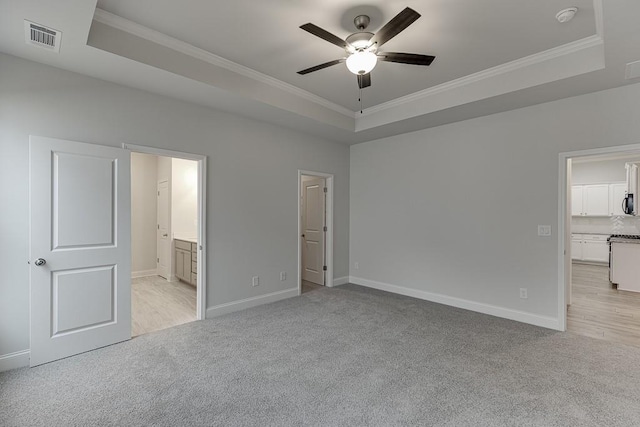 223 Montview Dr, Jefferson, GA 30549 - unfurnished bedroom with light carpet, crown molding, a tray ceiling, and visible vents