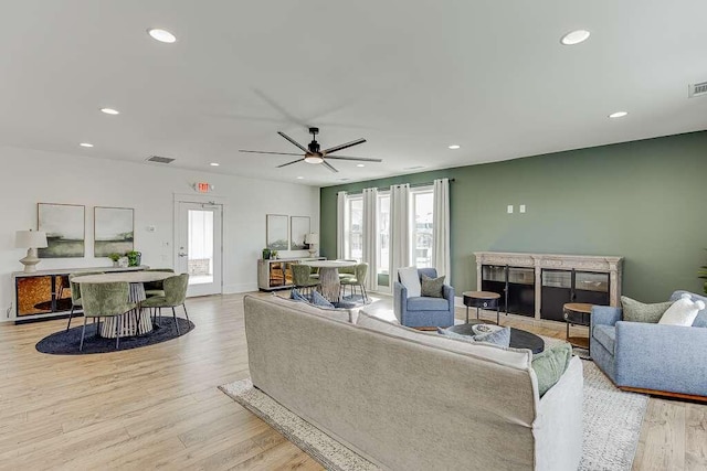 223 Montview Dr, Jefferson, GA 30549 - living room with light wood-type flooring, recessed lighting, a fireplace, and visible vents