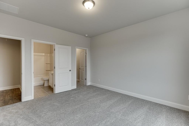 223 Montview Dr, Jefferson, GA 30549 - unfurnished bedroom with ensuite bathroom, carpet, baseboards, and visible vents