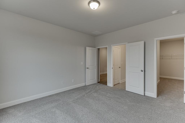 223 Montview Dr, Jefferson, GA 30549 - unfurnished bedroom with carpet, a closet, baseboards, and a spacious closet