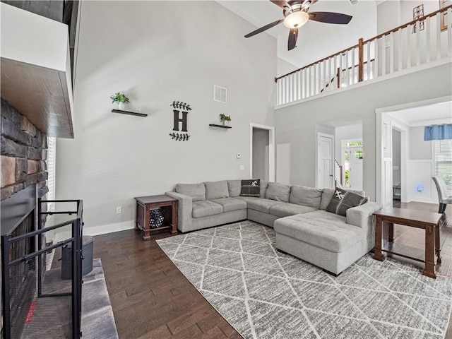 224 Blackthorn Rd, Colbert, GA 30628 - living area with ceiling fan, hardwood / wood-style floors, a fireplace, and a high ceiling