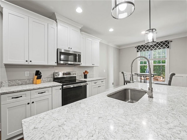 224 Blackthorn Rd, Colbert, GA 30628 - kitchen featuring appliances with stainless steel finishes, crown molding, white cabinets, pendant lighting, and recessed lighting