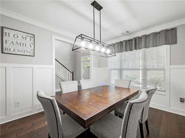 224 Blackthorn Rd, Colbert, GA 30628 - dining area with a decorative wall, dark wood-type flooring, a wainscoted wall, stairway, and ornamental molding