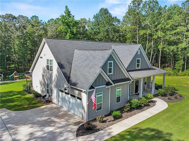 224 Blackthorn Rd, Colbert, GA 30628 - view of front of home with board and batten siding, covered porch, driveway, a front yard, and roof with shingles