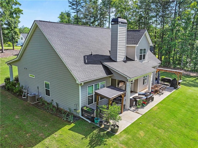 224 Blackthorn Rd, Colbert, GA 30628 - rear view of property with a chimney, a lawn, a shingled roof, and a patio area