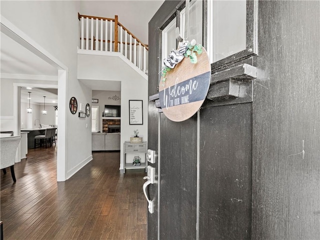 224 Blackthorn Rd, Colbert, GA 30628 - entrance foyer featuring a high ceiling, dark wood-style flooring, and crown molding