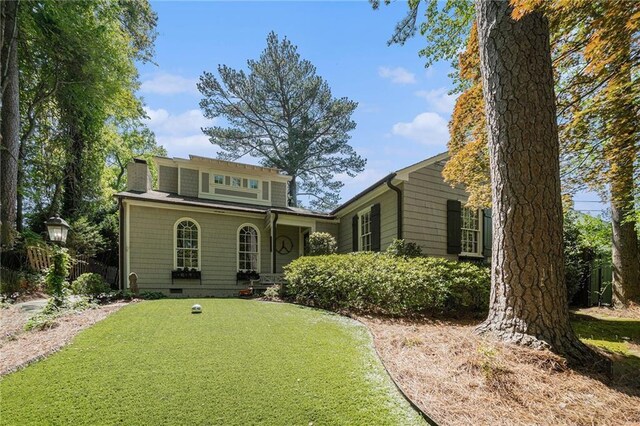1634 Lenox Rd NE, Atlanta, GA 30306 - view of front of house featuring a front yard, crawl space, and a chimney