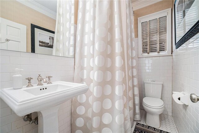 1634 Lenox Rd NE, Atlanta, GA 30306 - full bathroom with crown molding, a sink, tile walls, toilet, and tile patterned flooring