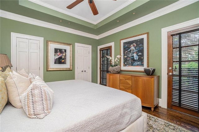 1634 Lenox Rd NE, Atlanta, GA 30306 - bedroom with access to outside, two closets, crown molding, a tray ceiling, and wood finished floors
